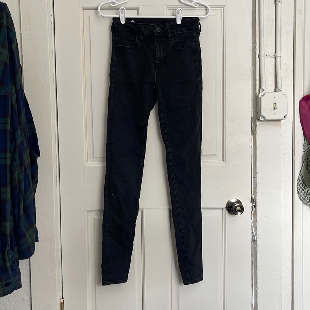 Plain black skinny jeans, long